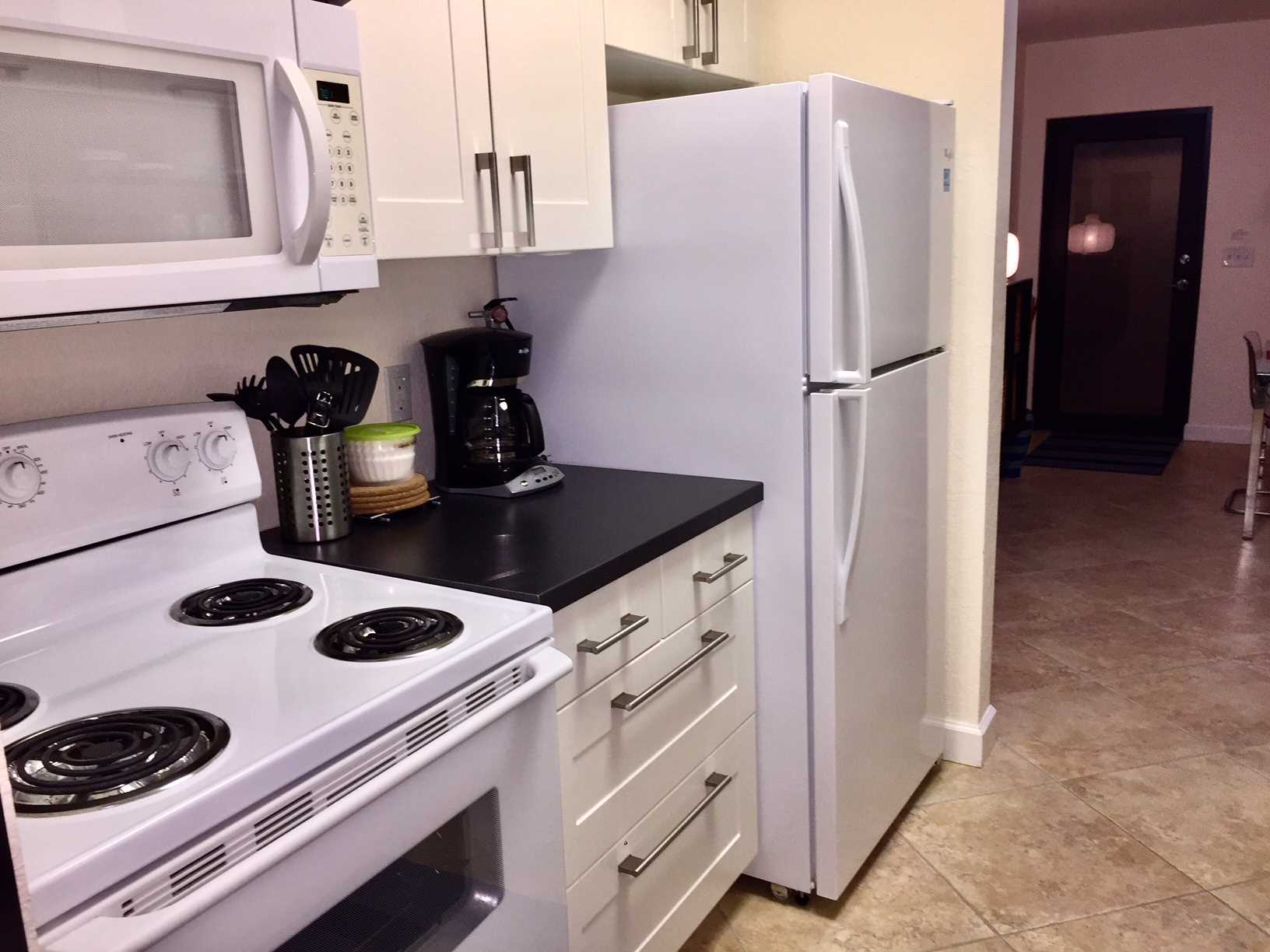 Kitchen has all new appliances including built-in microwave.
