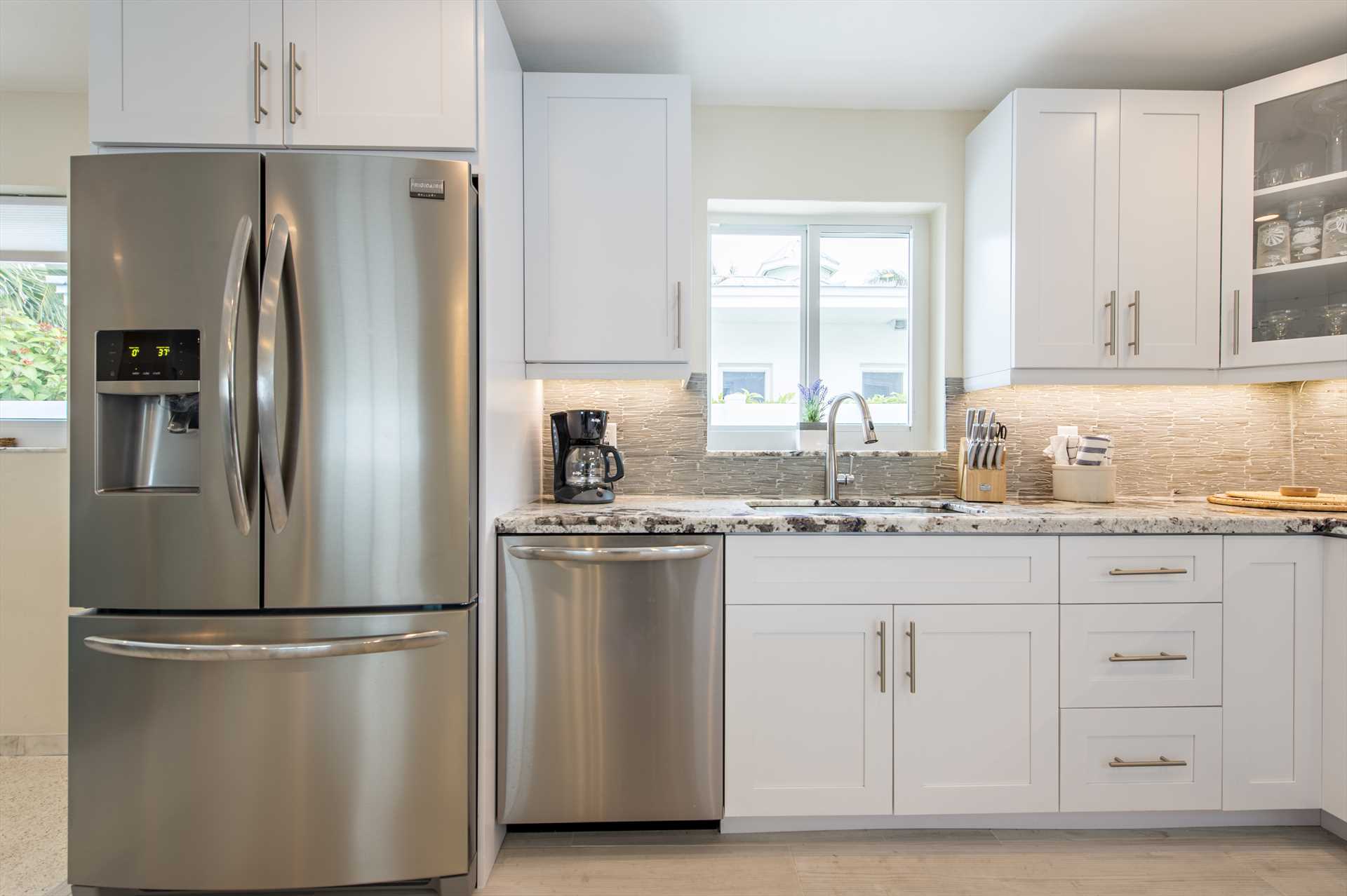 Fully equipped kitchen has all new stainless appliances and 
