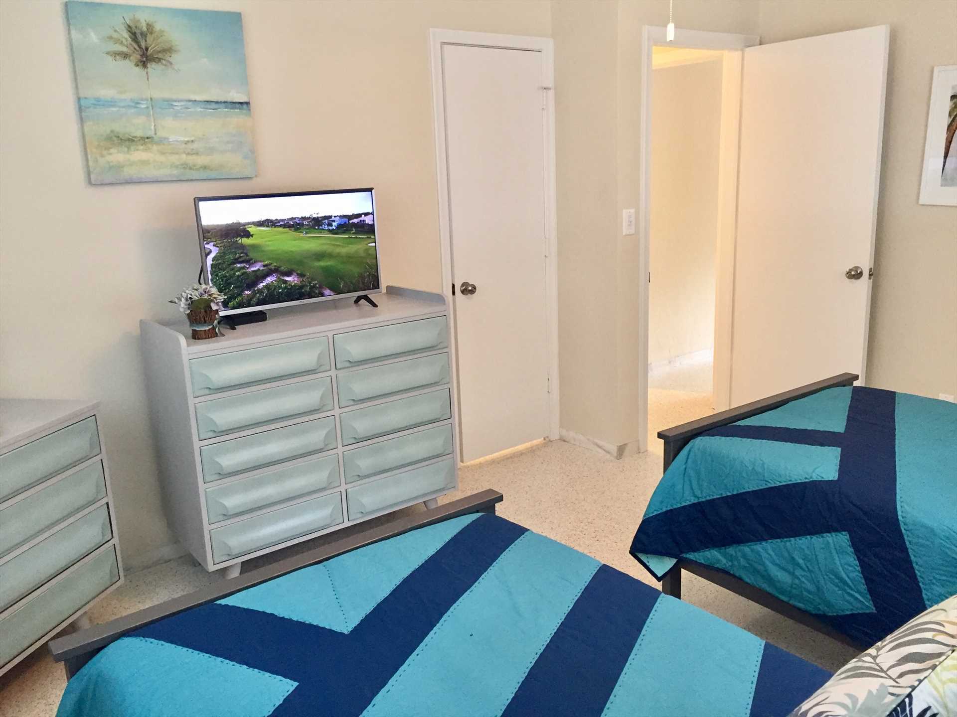 Twin bedroom has HDTV and private bath entrance.