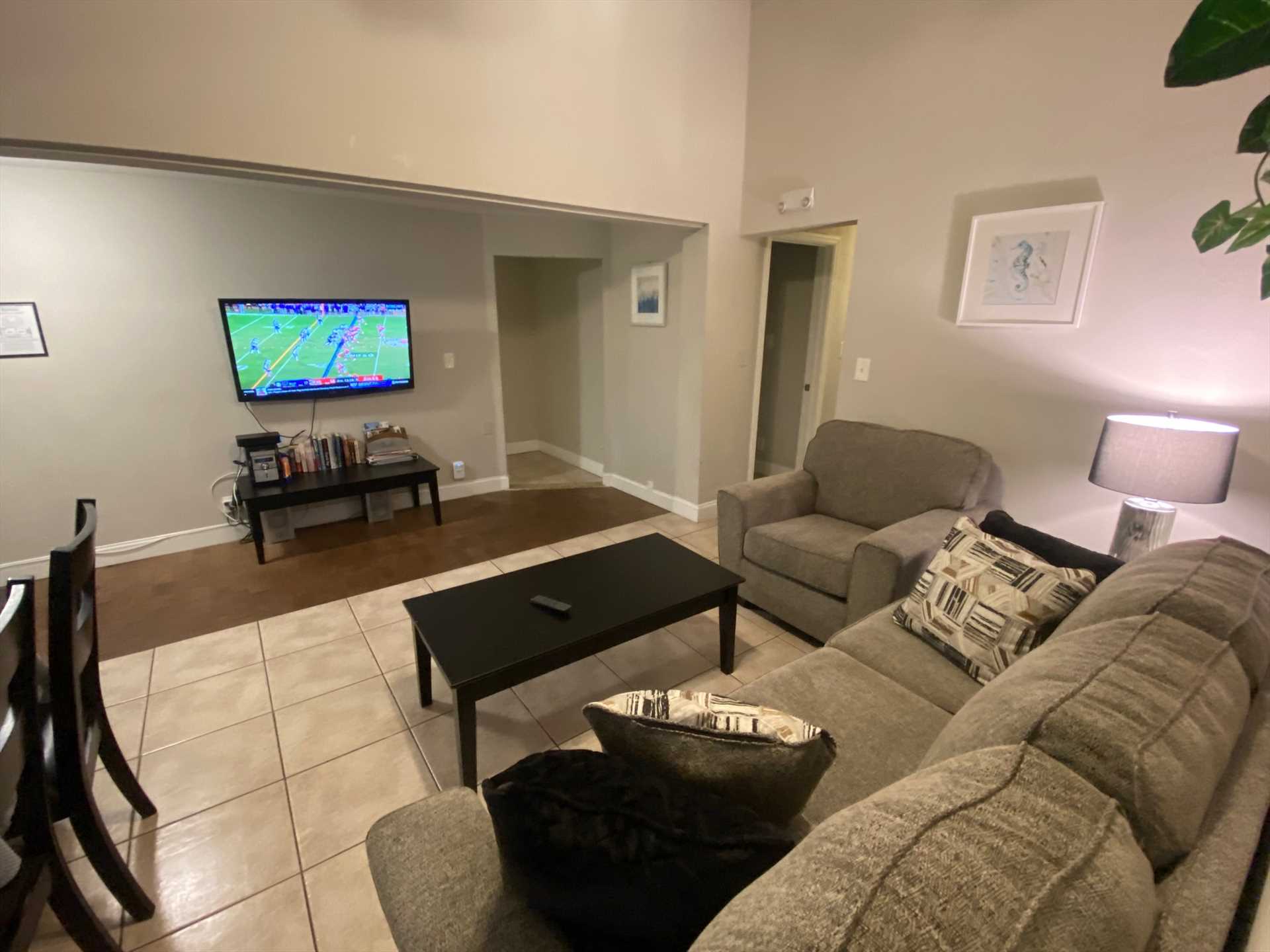 Living room has wall mounted HDTV and WIFI.